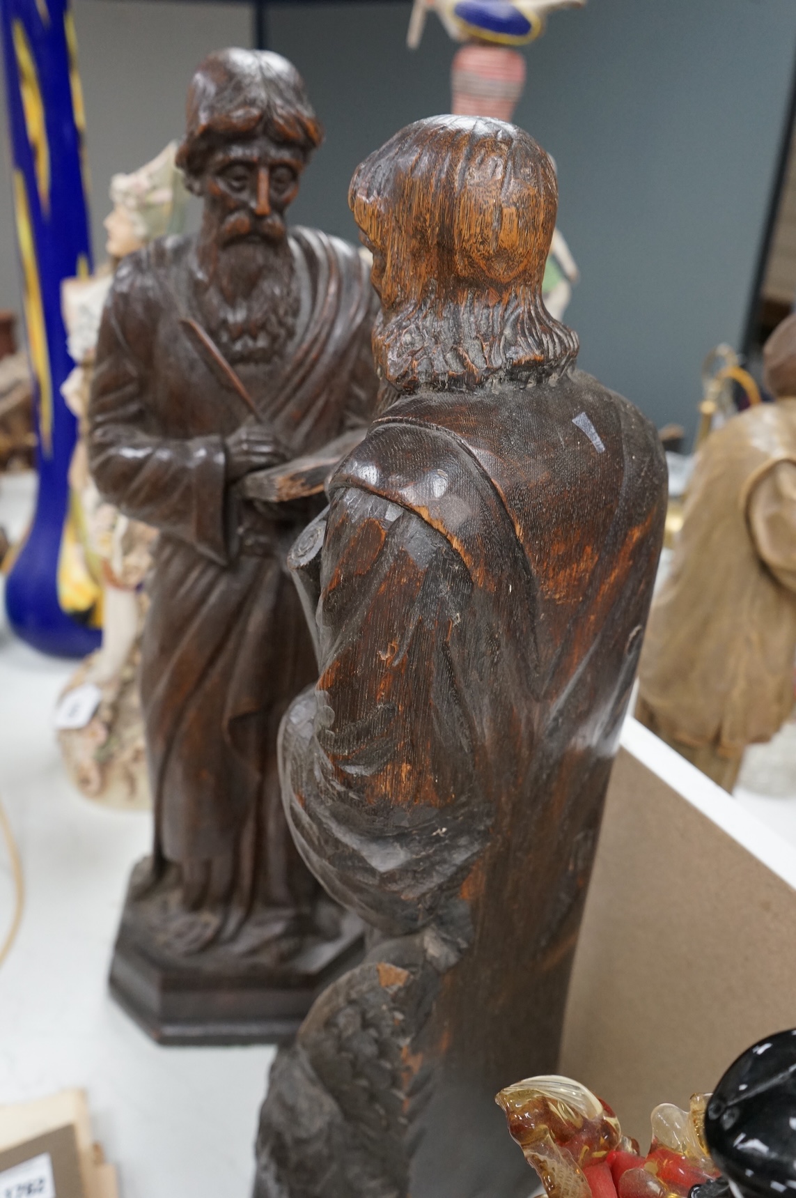 Two 19th century carved wood figures of standing scribes, 67cm